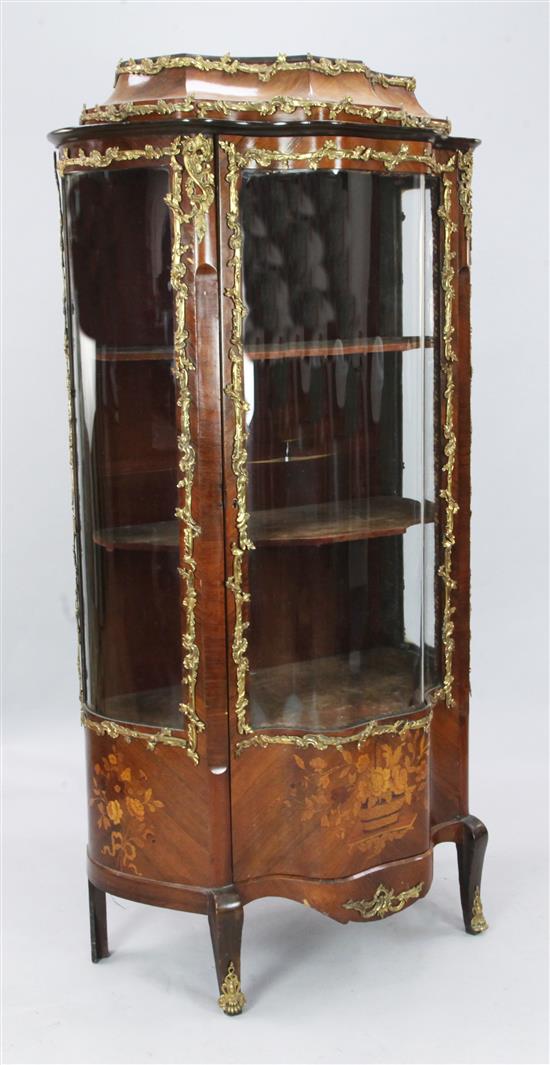 A 19th century Louis XV style gilt metal mounted and floral marquetry kingwood serpentine vitrine, W. 2ft 7in